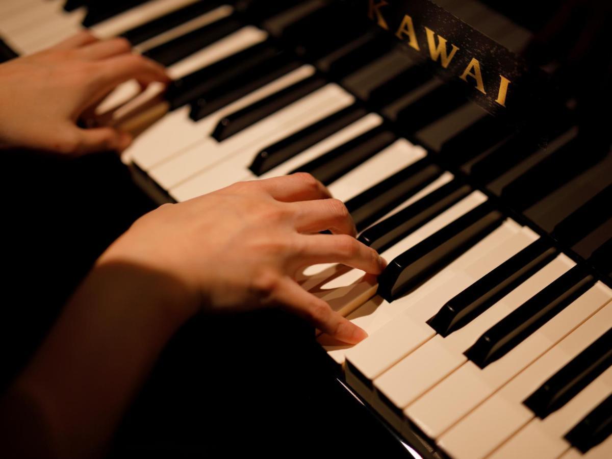 The Hotel Sanraku Kanazawa 21Th December 2022 Open Екстер'єр фото A pianist playing a Kawai piano